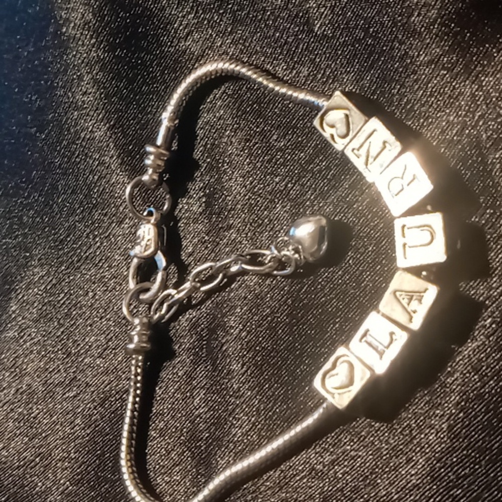 Laurn snake chain bracelet block letters. 7.5 - 9 in long extendable
